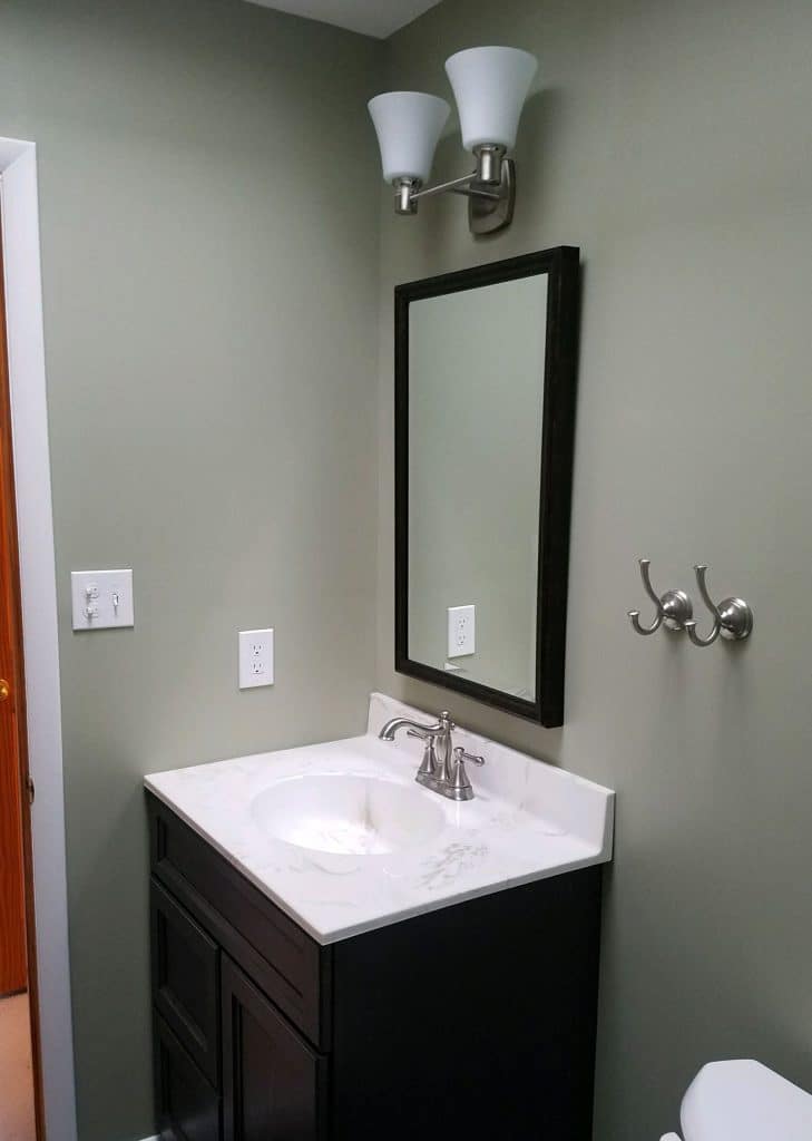 Clean modern bathroom makeover by J. Tretter and Sons